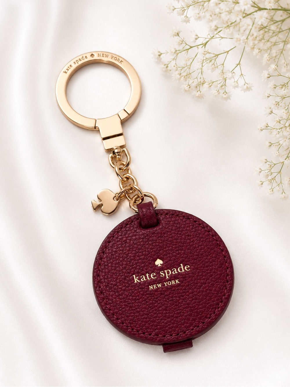 kate spade burgundy leather round keychain with gold hardware
